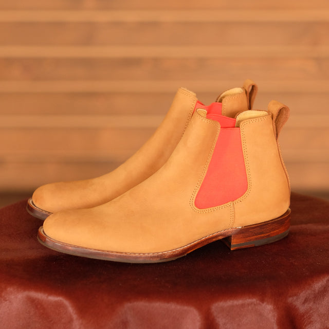 A Chelsea boot in natural nubuck leather, red elastic, leather pull tab
